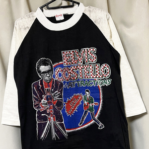 L 80s ビンテージ パキ綿 ELVIS COSTELLO エルビスコステロ 7分袖Tシャツ デッドストック ロックバンド パキスタン製 レア vintage FANTASY