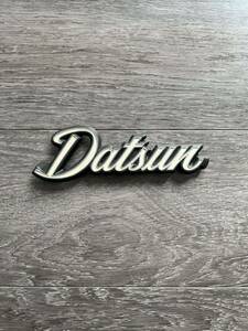 DATSUN emblem white character type that time thing 