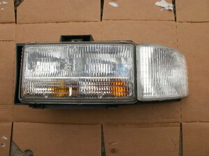  Cadillac brougham headlight left ( used )