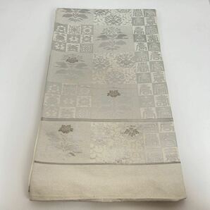 ■呉服屋 禅■ 未使用品 綴れ織 唐織 草花 銀糸 印相体 刺繍 プラチナ箔 袋帯 六通 和装 和服 着物 正絹 フォーマル 上代198000円 #KUR158の画像2