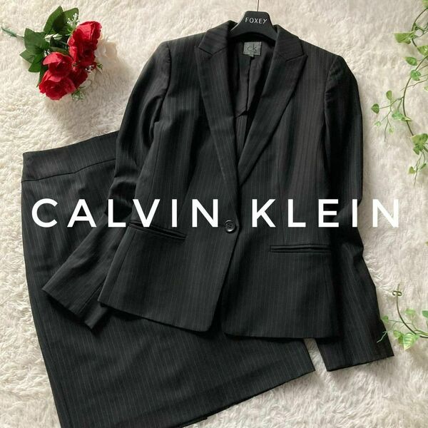 カルバンクライン　スカートスーツ　テーラードジャケット　背抜き　ストライプ　黒　レディース　4サイズ　Calvin Klein