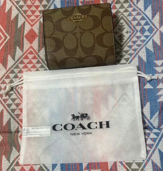 COACH 二つ折り財布 ベージュ