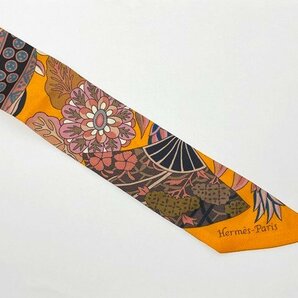 ◎HERMES エルメス ツイリー Fleurs et Papillons de Tissus 花咲く織物 リボン スカーフ シルク オレンジ系カラーの画像2