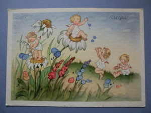 アンティーク　古いポストカード・絵葉書 　* 春の野辺でお花たちとはしゃぐエンジェル達 * 1940年記載