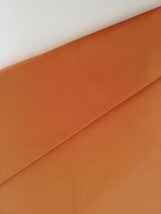 生地　オレンジ系　濃いオレンジ色　長さ2.5m 巾112cm 綿混　無地　日本製_画像2