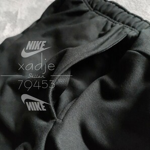 新品 正規品 NIKE DRI-FIT ナイキ ドライフィット スウェットパンツ ジョガーパンツ テーパード スウッシュ プリント 黒 ブラック Mの画像4