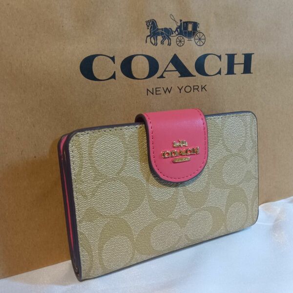 coach コーチ 2つ折り財布 ピンクボタンタイプ