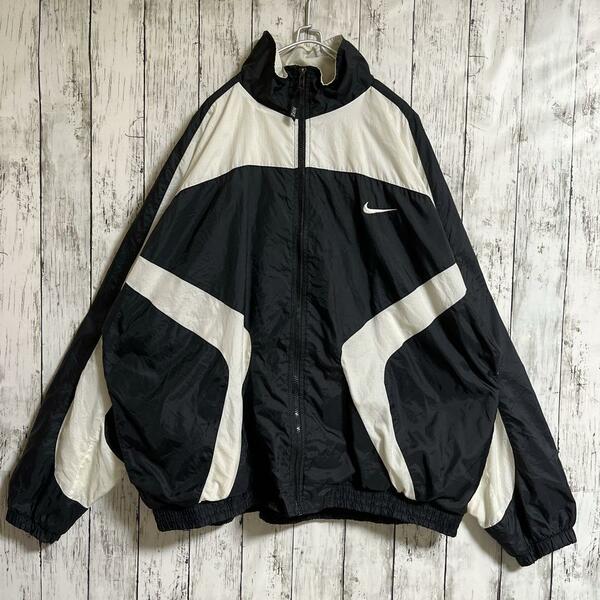 90's NIKE ナイキ 白タグ ナイロンジャケット 黒 ブラック 2XL ワンポイント 刺スウッシュ 90年代ヴィンテージ ビッグサイズ HTK3628