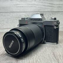 【YH-8668】中古現状品 Konica AUTO REFLEX T3 コニカ オートリフレックス 35-70mm F3.5 フイルムカメラ 一眼レフ 電池式 レンズキャップ付_画像1