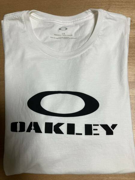 メ4157 OAKLEYオークリーロゴプリント　コットンTシャツ L