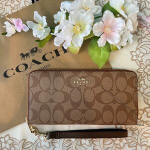 COACH シグネチャー ベージュ オレンジファスナー ストラップ