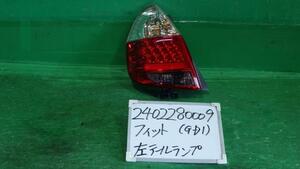 フィット DBA-GD1 左テールランプ 1.3Y NH700M 4995