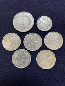  silver coin . summarize 7 sheets . 10 sen . two 10 sen 