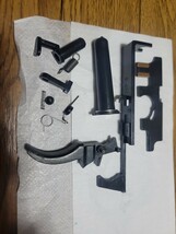 55・マルイ電動MP5 (ver2)　メカボックス内部パーツ　トリガー　中古品　※ノズル段差無しの現行品。_画像1