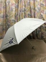 レノマ renoma 1級遮光生地使用 UVカット 晴雨兼用折りたたみ傘 日傘 花ラメ 水色 新品_画像1