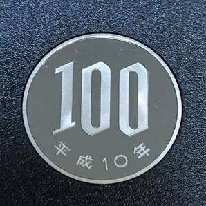 即決あり！ 平成10年 プルーフ貨幣セット 出し「100円」硬貨 完全未使用品 １枚  送料全国94円 ペーパーコインホルダー発送の画像1