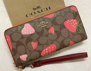 [新品未使用]COACHシグネチャーいちご柄ラウンドファスナー長財布