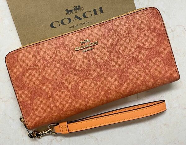 [新品未使用]COACHシグネチャー柄ラウンドファスナー長財布ストラップ付き コーチ　ギフトボックス付き