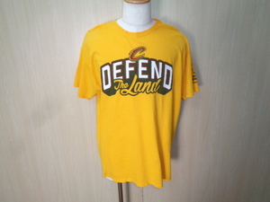 T67◆FRUIT OF THE LOOM製 DEFEND The Land Tシャツ◆フルーツオブザルーム サイズXL イエロー プリントロゴTee 綿100％ ネコポス 6E