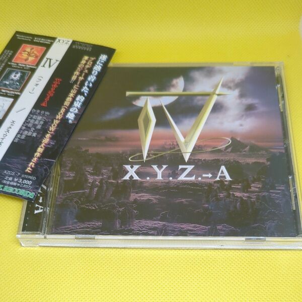 IV（4）／Ｘ．Ｙ．Ｚ．→Ａ　山本恭司（VOW WOW）二井原実（LOUDNESS）橘高文彦（筋肉少女隊）