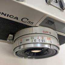 5-00296【コニカ KONICA C35 フィルムカメラ コンパクトカメラ】f=38mm 1.2.8 シャッター音OK ストラップ付き レトロ 1円スタート 1円出品_画像9