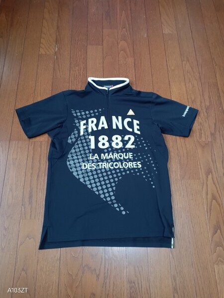 1285【中古品】le coq sportif ルコックスポルティフ ゴルフ 速乾性素材 ハーフジップТシャツ ブラックプリント メンズ サイズ M