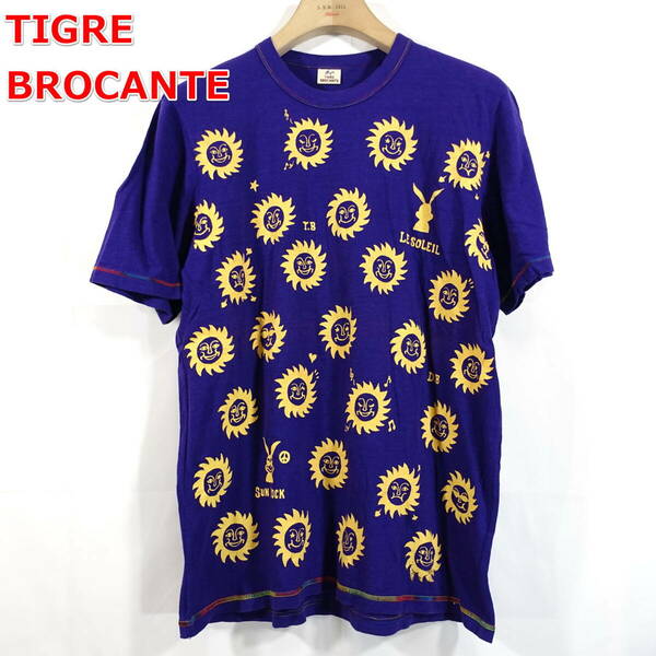 【良品】ティグルブロカンテ　太陽柄プリントＴシャツ　Tigre Brocante　サイズ３（Ｌ）　紫黄
