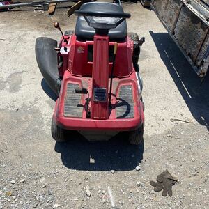  inspection, service being completed Honda passenger use lawnmower 3011 mower gasoline traction metal fittings attaching 