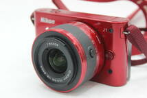 Y1115 ニコン Nikon 1 J1 レッド 1Nikkor 10-30mm F3.5-5.6 VR ミラーレス一眼 ボディレンズセット ジャンク_画像1