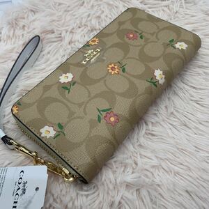 新品未使用　コーチCOACHシグネチャー ノスタルジック デイジーストラップ付き長財花柄