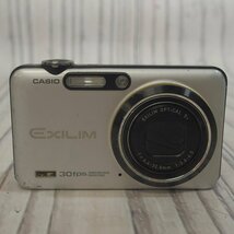 f002l Y3 2.カシオ CASIO EXILIM EX-FC100 コンパクトデジタルカメラ/EXILIM OPTICAL 5x f=6.4-32.0mm 1:3.6-4.5 本体のみ 動作未確認_画像1