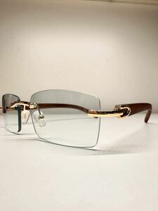  light green rim less sunglasses wood grain frame gold color equipment ornament times less gold color equipment ornament 