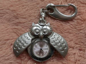 * battery replaced *..../ owl * luck ... bird * made in Japan Movement *.. thing * face is purple light pink * Old quarts * antique 