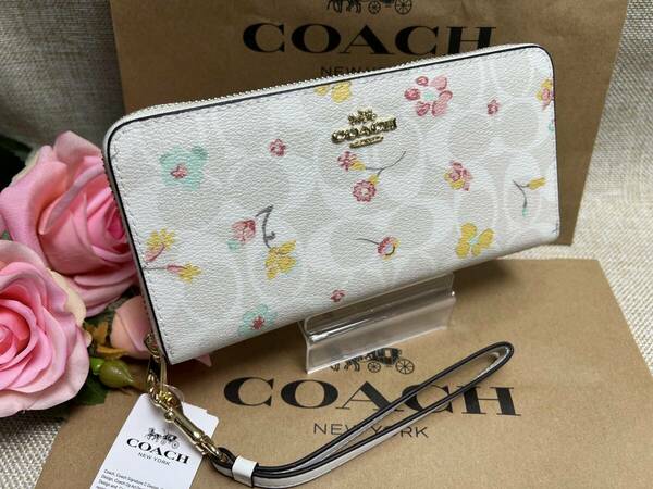 コーチ COACH 財布 レディース 長財布 フローラルプリント花柄 ストラップ ラウンドファスナー シグネチャー ピンク レザー C8695 A101