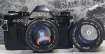 【整備済収集品】 Canon AE-1 黒 美品＋NEW FD 50mm f1.4＋FD 135mm f3.5 単焦点2本セット 各動作良好 露出計OK 光学良好 持病鳴きなし_画像1