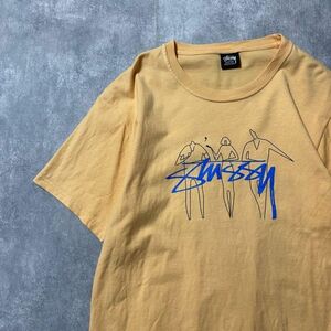 ステューシー　人物ロゴ　落書きプリント　ベージュ　Tシャツ