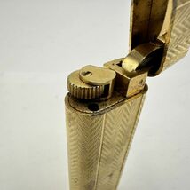 H110-SK12-597 ◎ Cartier カルティエ ガスライター オーバル型 ゴールドカラー 喫煙具 喫煙グッズ 火花あり ①_画像5