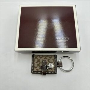 I110-SK14-982 * COACH Coach key holder notebook type signature Picture frame bag charm box attaching ①