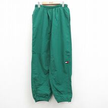 W31/古着 トミーヒルフィガー ブランド ナイロン パンツ メンズ 90s ワンポイントロゴ 緑 グリーン spe 24may15 中古 ボトムス ロング_画像1