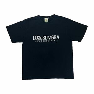 LUZeSOMBRA ルースイソンブラ フットボール サッカー 半袖 Tシャツ ロゴプリント ブラック M