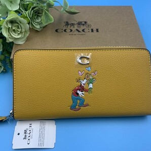 コーチ COACH 長財布 財布 ディズニーコラボ　イエロー プレゼント 贈り物 ラウンドファスナー ロングジップ 新品未使用 CH498 C084