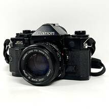 1円~【動作未確認】キャノン Canon A-1 LENS FD 50mm 1:1.4 一眼レフ フィルムカメラ 単焦点レンズ 標準レンズ ストラップ付き J110204_画像1