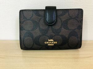 ◯COACH コーチ 二つ折り財布 ブラウン シグネチャー レディース