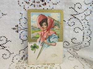 アンティーク　絵葉書　ポストカード　エンボス　女性　農具　ボンネット帽子　家　四葉のクローバー　金彩　アメリカ切手1910年