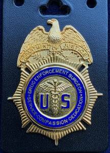  American narcotic taking . department drug *en force men to*sa- John badge 