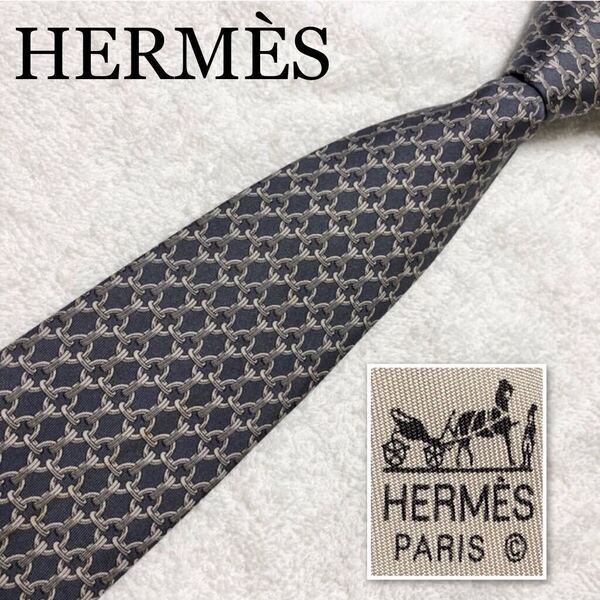 ■良品■HERMES エルメス ネクタイ リング 金具 網目状 総柄 シルク100% フランス製 グレー ビジネス