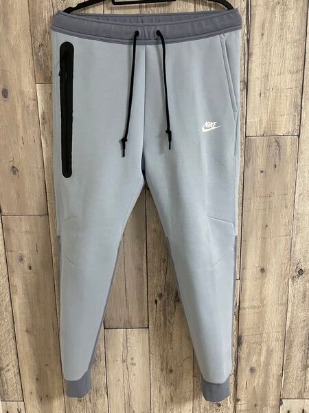 現行モデル 赤タグ ナイキ メンズL テックフリース パンツ 水色 ブルー