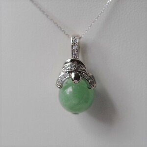 10.4mm.. circle pendant top natural less processing jade 