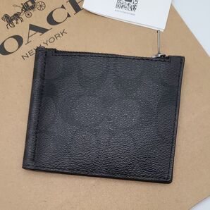 新品 COACH マネークリップ 折り財布 シグネチャー