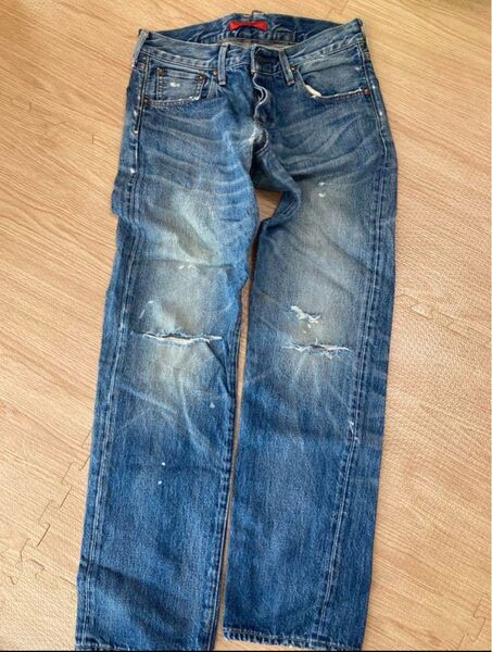 レッドカード ダメージ加工デニムパンツ